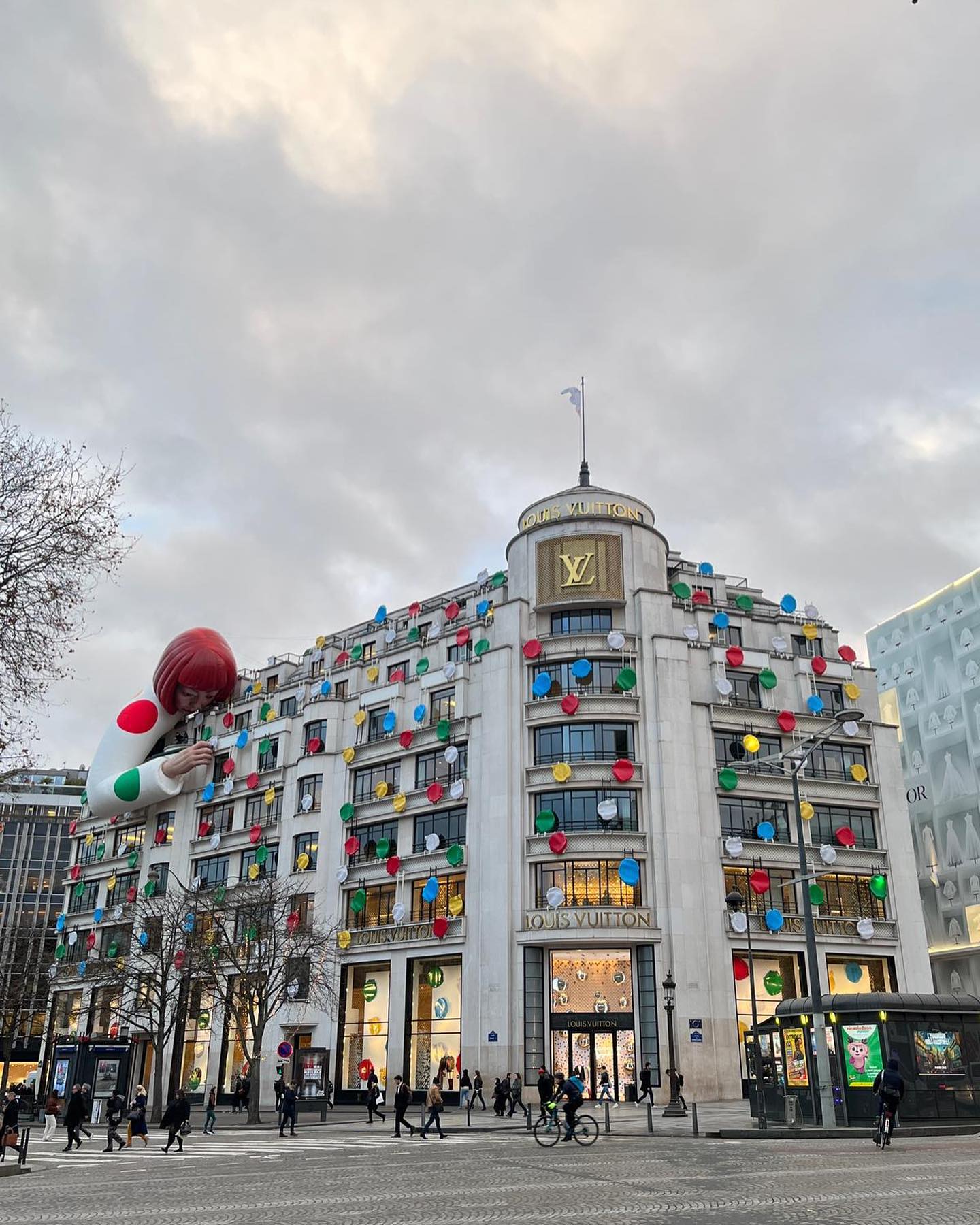 Robot of artist Yayoi Kusama in window of NY Louis Vuitton store